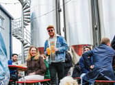 People and pooches enjoying the Blackhorse Beer Mile. Credit: Luis Kramer