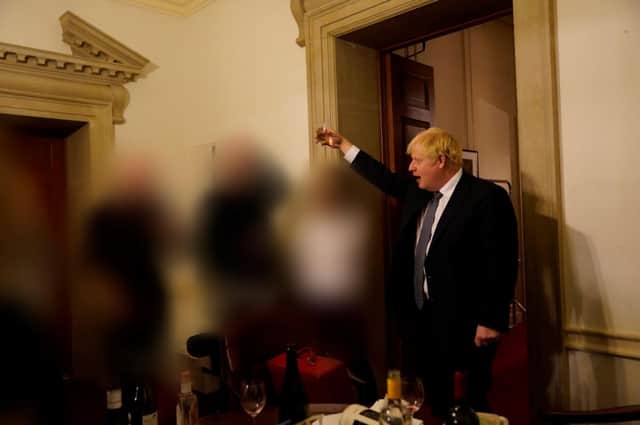 Prime Minister Boris Johnson is seen holding a drink at a gathering in 10 Downing Street on the departure of a special adviser. Photo: UK Government via Getty