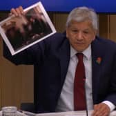 Unmesh Desai held up a photograph of the PM during a City Hall meeting: Photo: LW