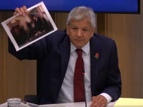 Unmesh Desai held up a photograph of the PM during a City Hall meeting: Photo: LW