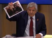 Unmesh Desai held up a photograph of the PM during a City Hall meeting: Photo: LW