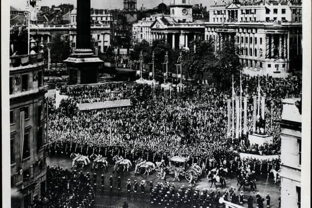 Crowds in Trafalgar Square for the coronation - like the ones George had to repel outside Buckingham Palace. Credit: Hulton Archive/Getty Images