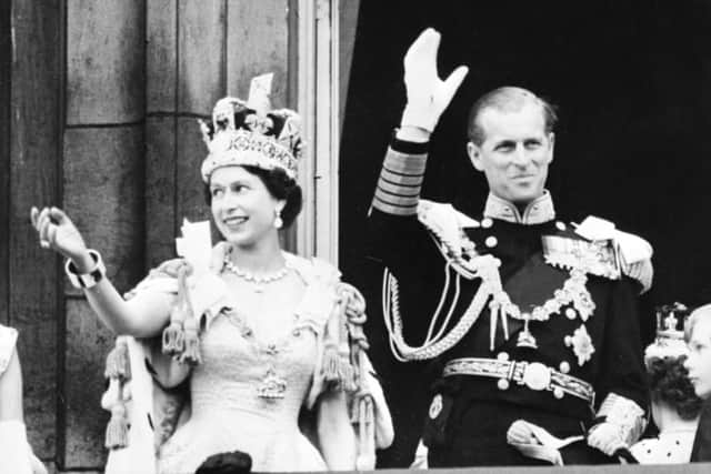 Britain’s Queen Elizabeth II (L) accompanied by Britain’s Prince Philip, Duke of Edinburgh (R) waves to the crowd, June 2, 1953 after being crowned at Westminster Abbey in London. Credit: INTERCONTINENTALE/AFP via Getty