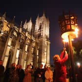 Reverand Jane Hedges, Canon of Westminster Abbey, lights a beacon outside the Abbey as part of Diamond Jubilee celebrations on June 4, 2012 in London, England