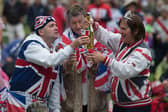 Brits will be celebrating the Platinum Jubilee with street parties. Credit: OLI SCARFF/AFP via Getty Images