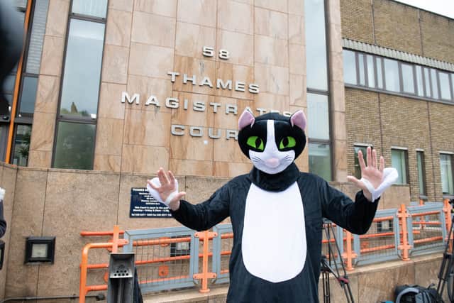 Zouma was greeted by a crowd of press, including one person in a giant cat costume. Photo: SWNS