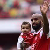 Alexandre Lacazette waves goodbye to Arsenal fans.