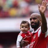 Alexandre Lacazette waves goodbye to Arsenal fans.