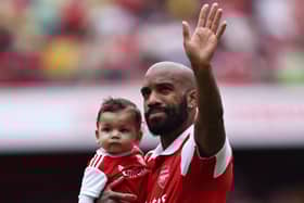 Alexandre Lacazette waves goodbye to Arsenal fans.