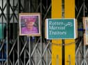  A poster reading ‘Rotten Marxist Traitors’ has been pasted on the closed gates at Shepherd’s Bush station.