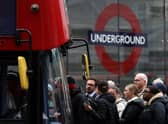 Commuters attempt to board a bus outside Victoria train station in London on June 6, 2022, during a 24-hour strike by nearly 4,000 London Underground station staff. (Photo by HOLLIE ADAMS/AFP via Getty Images)