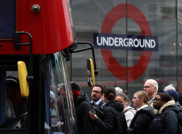 Commuters attempt to board a bus outside Victoria train station in London on June 6, 2022, during a 24-hour strike by nearly 4,000 London Underground station staff. (Photo by HOLLIE ADAMS/AFP via Getty Images)