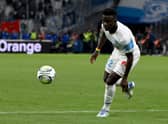 Marseille's Senegalese forward Bamba Dieng runs with the ball (Photo by Nicolas TUCAT / AFP) (Photo by NICOLAS TUCAT/AFP via Getty Images)