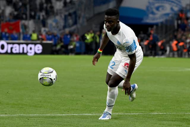 Marseille’s Senegalese forward Bamba Dieng runs with the ball during the French L1 (Photo by Nicolas TUCAT / AFP) (Photo by NICOLAS TUCAT/AFP via Getty Images)