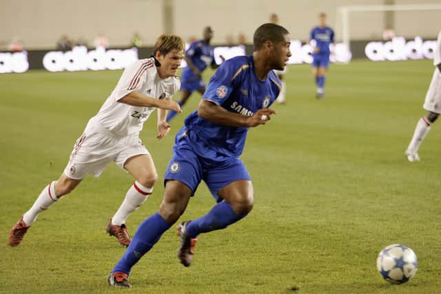 Glen Johnson #2 of Chelsea FC moves the ball past Johann Vogel #14 of AC Milan (Photo by Brian Bahr/Getty Images)