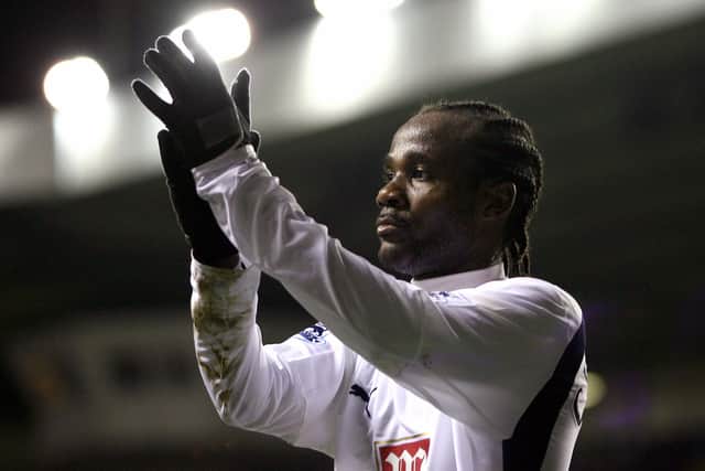 Tottenham's French international defender Pascal Chimbonda applauds (Photo credit should read CHRIS YOUNG/AFP via Getty Images)