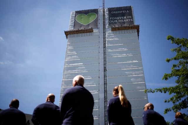 Firefighters paying tribute to the victims of the Grenfell Tower fire, as the building is set to be demolished over safety fears
