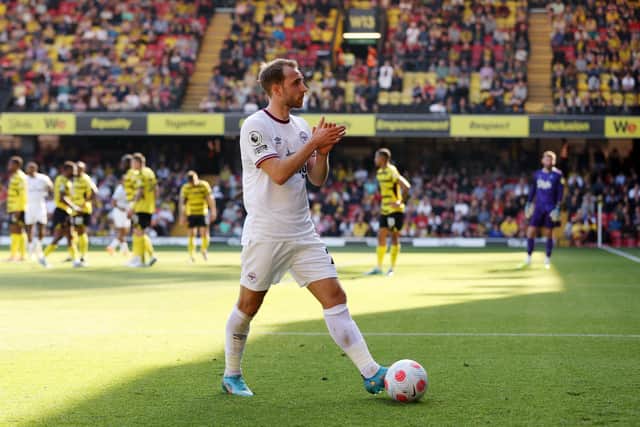  Christian Eriksen of Brentford applauds the away fans as he walks over for a corner kick  (Photo by Matthew Lewis/Getty Images)