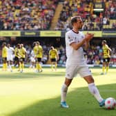 Christian Eriksen of Brentford applauds the away fans as he walks over for a corner kick (Photo by Matthew Lewis/Getty Images)