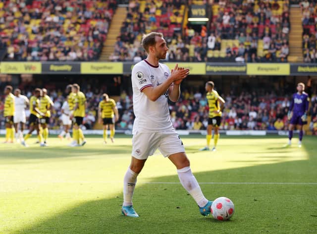Christian Eriksen of Brentford applauds the away fans as he walks over for a corner kick (Photo by Matthew Lewis/Getty Images)