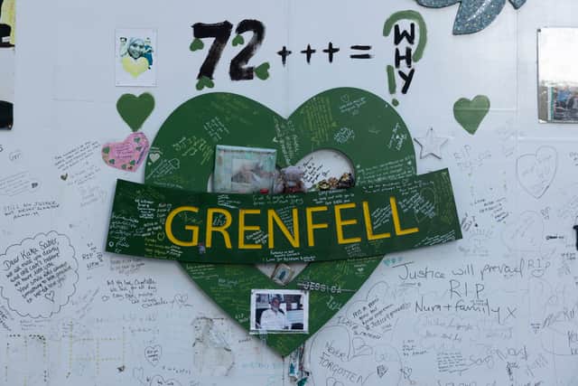 The memorial wall underneath the Grenfell Tower has tributes to the 72 people who lost their lives during the fire
