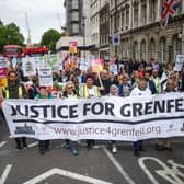 Members of the Justice for Grenfell group march down Whitehall. Photo: Getty