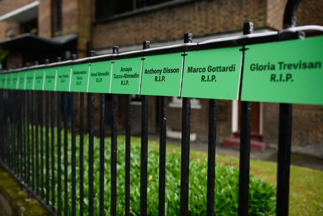 The names of some of the victims are seen on a railing near to the site of Grenfell Tower. Credit: Leon Neal/Getty Images