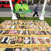 Photos of the victims of Grenfell Tower laid out. Credit: CHRIS J RATCLIFFE/AFP via Getty Images