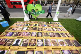 Photos of the victims of Grenfell Tower laid out. Credit: CHRIS J RATCLIFFE/AFP via Getty Images