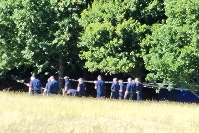 Officers appeared to be searching an area of the park. Photo: LW