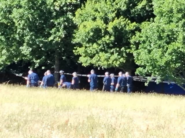 Officers appeared to be searching an area of the park. Photo: LW