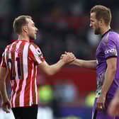 Harry Kane of Tottenham Hotspur embraces Christian Eriksen of Brentford after the Premier League (Photo by Ryan Pierse/Getty Images)