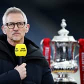 Gary Lineker, BBC Sport TV Pundit looks on whilst standing next to the FA Cup (Photo by Alex Pantling/Getty Images)