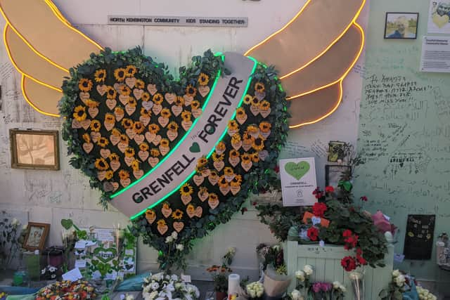 Floral tributes lay near the foot of the tower