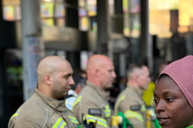 A group of firefighters, wearing Grenfell hero badges, formed a guard of honour opposite Ladbroke Grove Tube station in an emotional display of solidarity. Credit: Damondo Dar