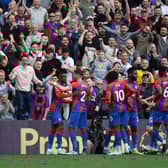 Wilfried Zaha of Crystal Palace celebrates with teammates after scoring their team's first goal (Photo by Tom Dulat/Getty Images)