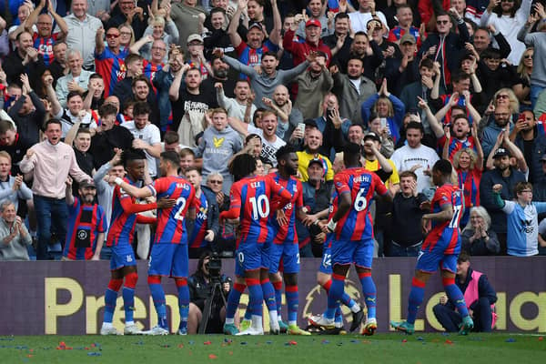 Wilfried Zaha of Crystal Palace celebrates with teammates after scoring their team's first goal (Photo by Tom Dulat/Getty Images)