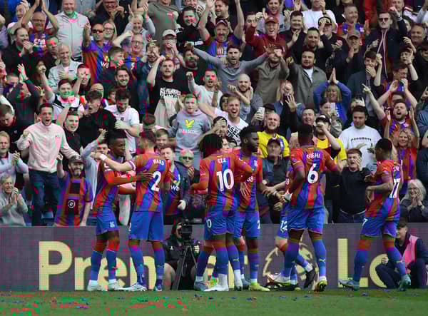 Wilfried Zaha of Crystal Palace celebrates with teammates after scoring their team's first goal (Photo by Tom Dulat/Getty Images)