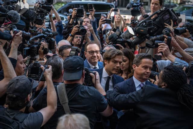 Kevin Spacey surrounded by cameras at Westminster Magistrates’ Court. Credit: Carl Court/Getty Images