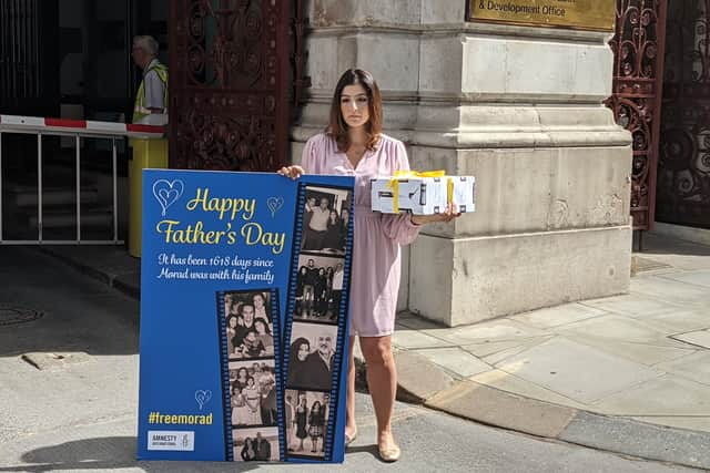 Roxanne Tahbaz outside the Foreign Office with a Father’s Day card and gift for her father Morad