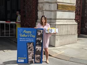 Roxanne Tahbaz outside the Foreign Office with a Father’s Day card and gift for her father Morad
