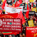 Protesters march with placards and trades union banners during a demonstration organised by the Trades Union Congress (TUC) in 2018. (Photo: Getty)