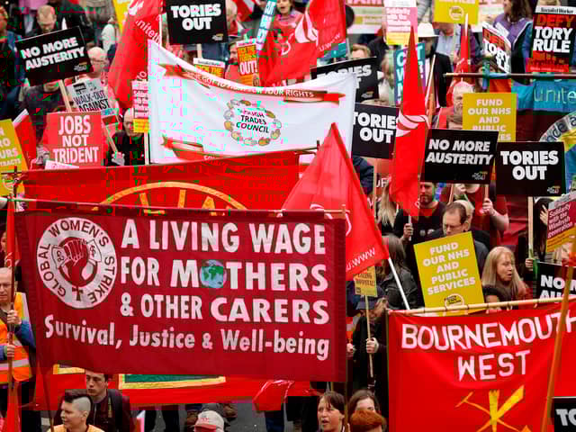 Protesters march with placards and trades union banners during a demonstration organised by the Trades Union Congress (TUC) in 2018. (Photo: Getty)