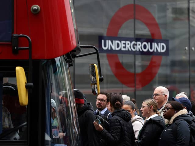 Commuters attempt to board a bus outside Victoria train station in London on June 6, 2022, during a 24-hour strike. Photo: Getty