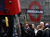 Commuters attempt to board a bus outside Victoria train station in London on June 6, 2022, during a 24-hour strike. Photo: Getty
