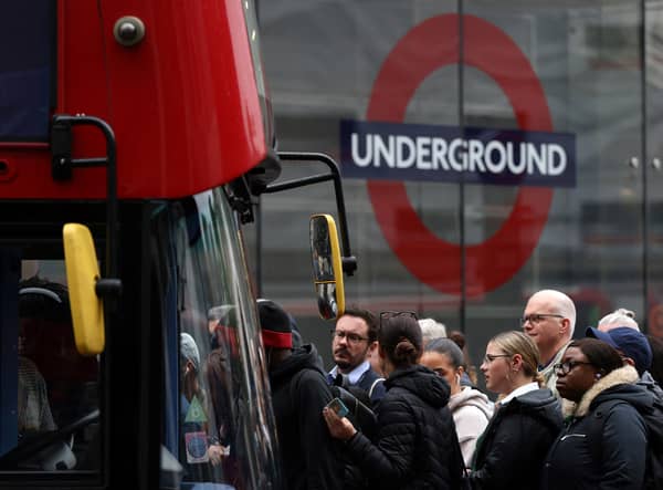Commuters attempt to board a bus outside Victoria train station in London on June 6, 2022, during a 24-hour strike. Photo: Getty