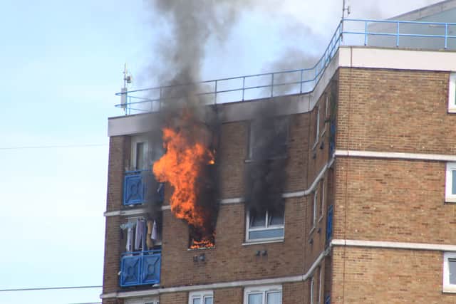 Flames broke out in part of a flat on the 13th floor of the building, on Grantham Road, in Manor Park. Photo:  TJ Stamp @TJStamp
