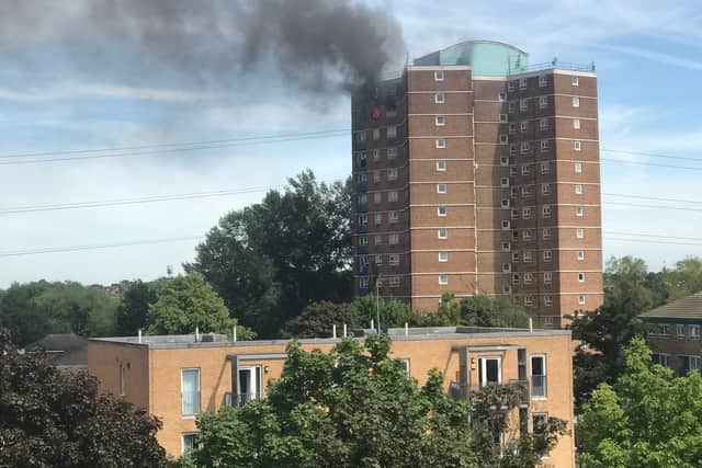 Smoke can be seen pouring from the building. Photo:  TJ Stamp @TJStamp