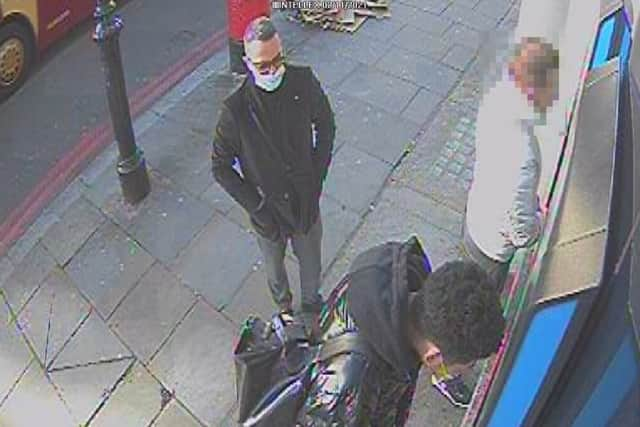 Aldorasi watching a victim at a cash machine. Photo: Met Police