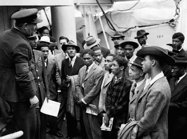 File photo dated 22/06/48 of Jamaican immigrants welcomed by RAF officials from the Colonial Office after the ex-troopship HMT Empire Windrush landed them at Tilbury (Photo: PA)